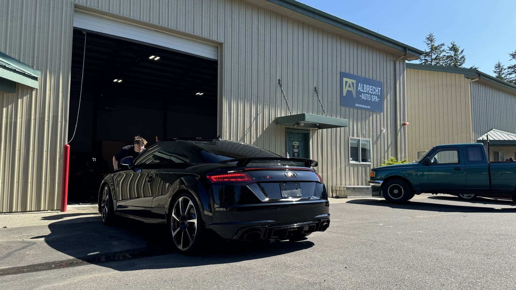 Black Audi TT RS being detailed in the bay at Albrecht Auto Spa in Ferndale, WA