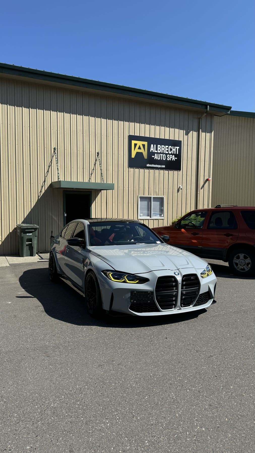 Front of a grey BMW M3 G80 after detailing at Albrecht Auto Spa in Ferndale, WA