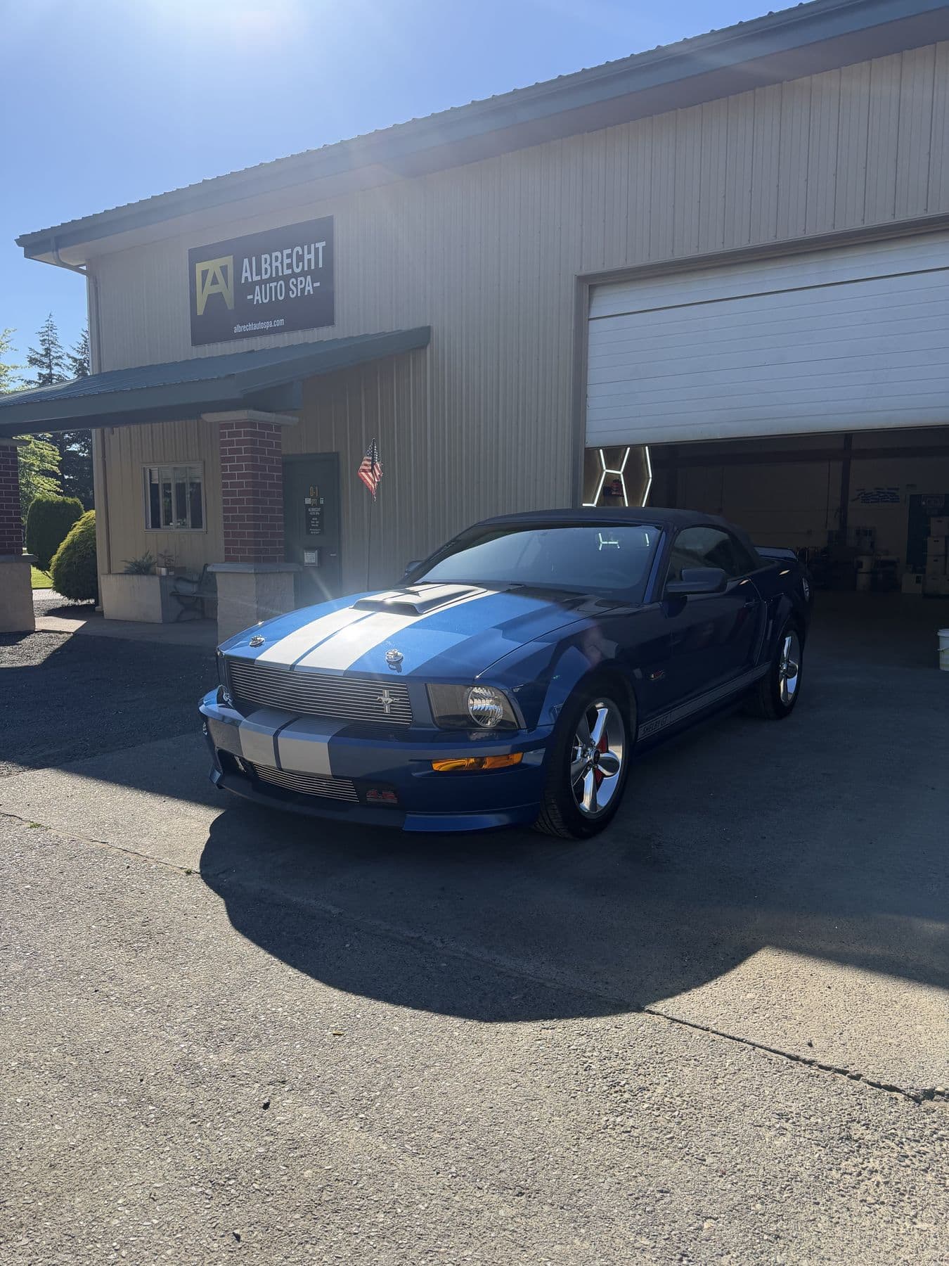 Blue Ford Mustang GT with racing stripes corrected and detailed at Albrecht Auto Spa in Ferndale, WA