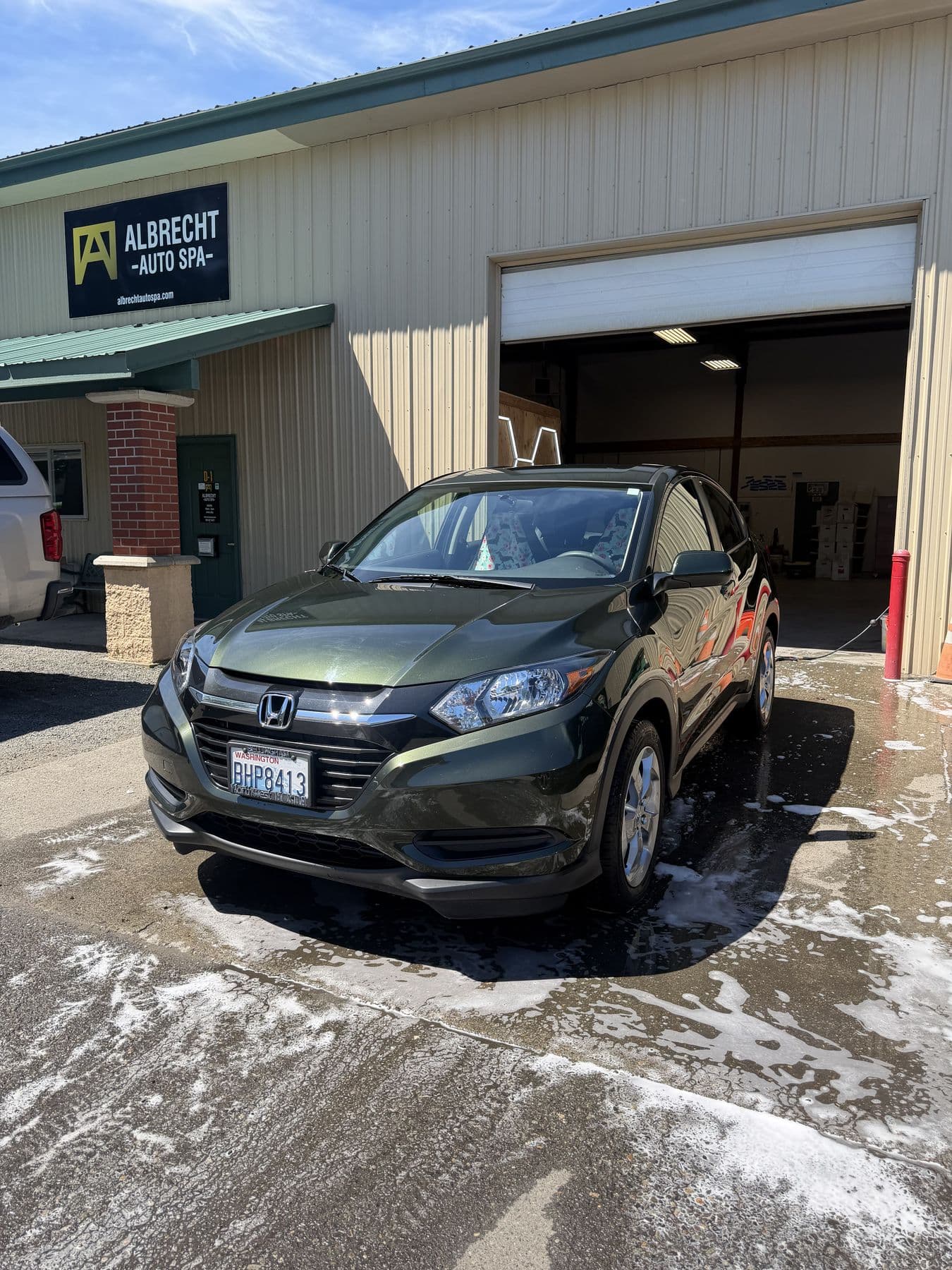 Honda HR-V mid hand wash with suds on the paint at Albrecht Auto Spa in Ferndale, WA