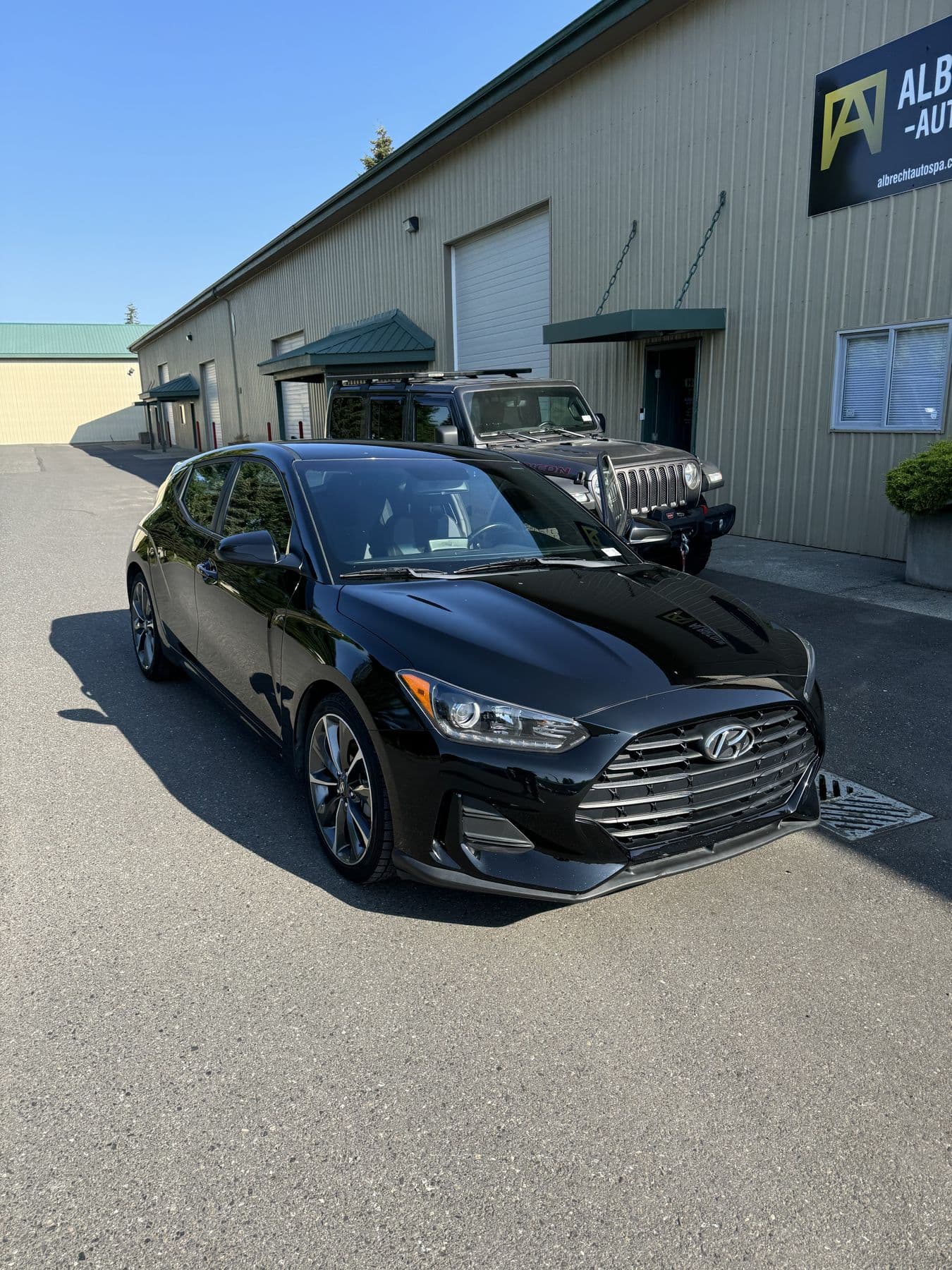 Black Hyundai Veloster after an exterior detail at Albrecht Auto Spa in Ferndale, WA