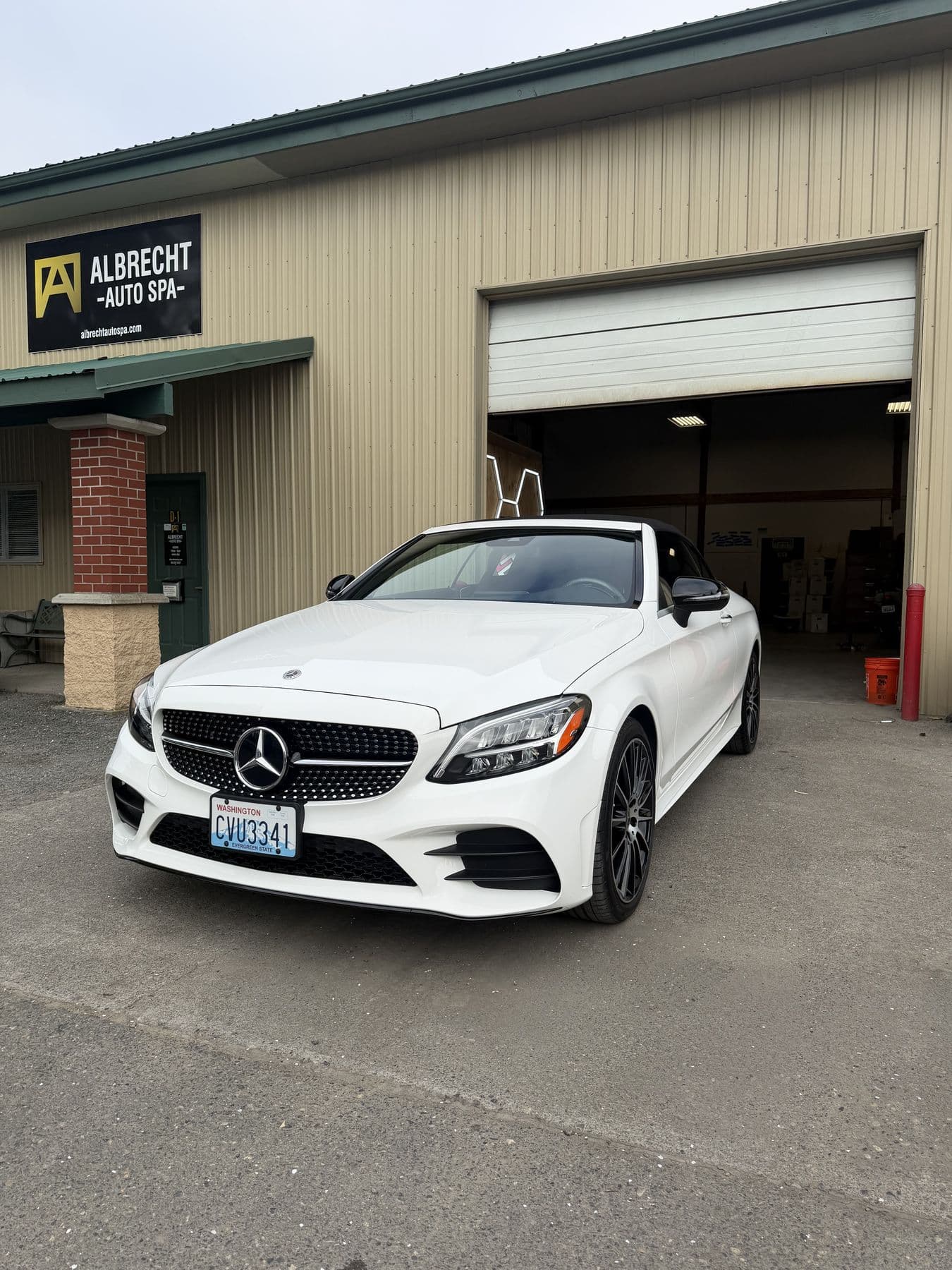 White Mercedes-Benz cabriolet ceramic coated outside Albrecht Auto Spa in Ferndale, WA