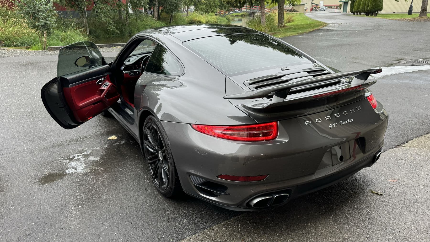 Rear three-quarter of a grey Porsche 911 Turbo after an exterior detail at Albrecht Auto Spa in Ferndale, WA