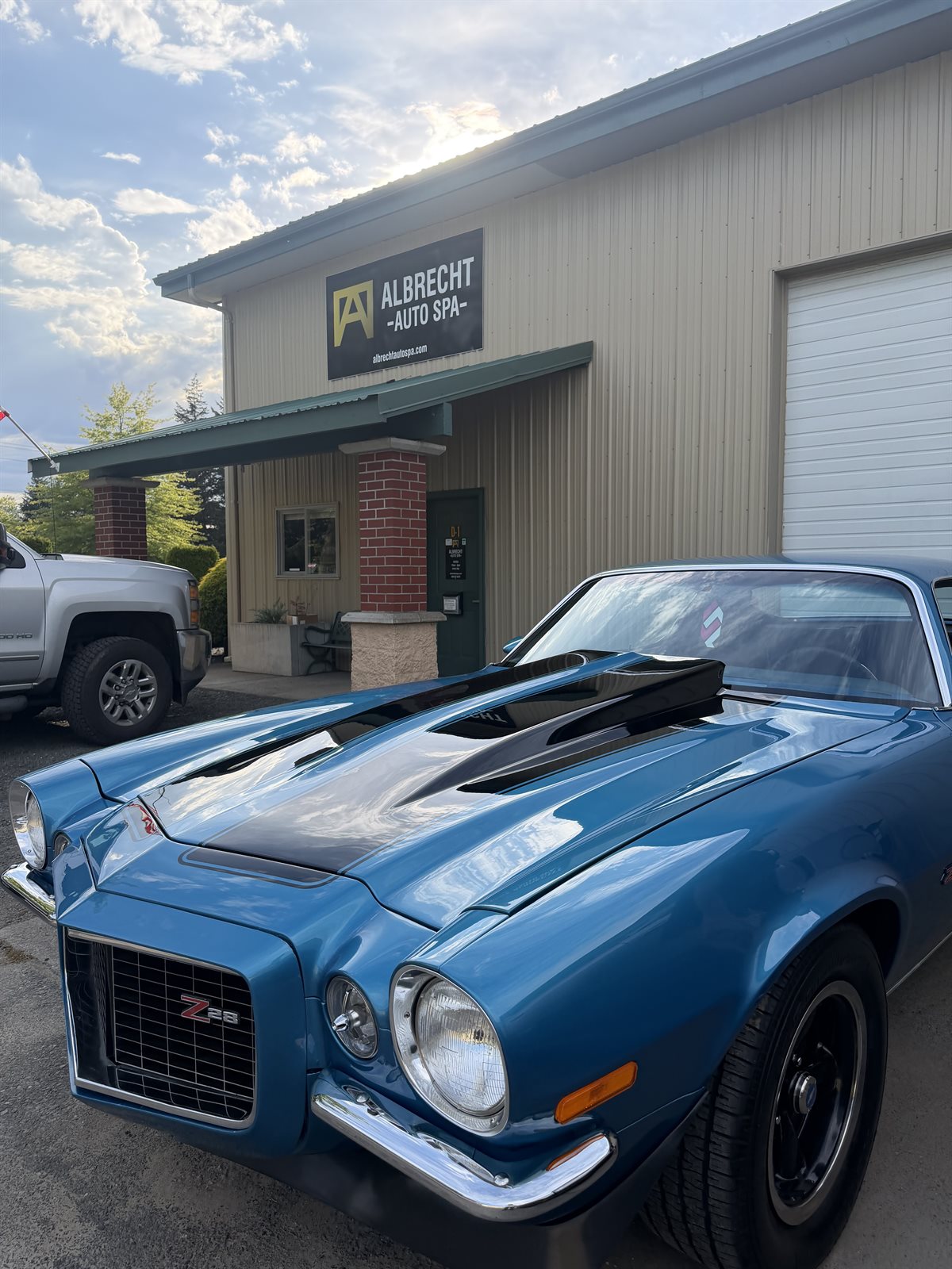 Classic blue Chevrolet Camaro Z28 in the Albrecht Auto Spa driveway